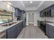 Updated kitchen featuring gray cabinets, stainless steel appliances, and a view of the pool at 1363 Brookside Dr, Venice, FL 34285