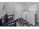 Laundry room with washer, dryer, and bench at 1363 Brookside Dr, Venice, FL 34285