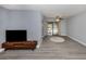 Spacious living area with gray floors and a view of the pool at 1363 Brookside Dr, Venice, FL 34285
