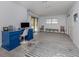 Home office featuring a blue desk, tile floor, and view of the pool at 1363 Brookside Dr, Venice, FL 34285