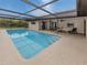 Relaxing screened pool with patio access at 1363 Brookside Dr, Venice, FL 34285
