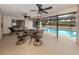 Inviting pool area with patio furniture and screened enclosure at 1363 Brookside Dr, Venice, FL 34285