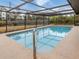 Refreshing screened pool with concrete decking at 1363 Brookside Dr, Venice, FL 34285