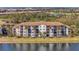 Condo building with water access and lush landscaping at 17108 Vardon Ter # 308, Bradenton, FL 34211