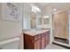 Bathroom boasts granite countertop and walk-in shower at 17108 Vardon Ter # 308, Bradenton, FL 34211