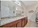 Double vanity bathroom with granite countertop at 17108 Vardon Ter # 308, Bradenton, FL 34211