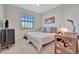 Twin bedroom with built-in workspace and window at 17108 Vardon Ter # 308, Bradenton, FL 34211