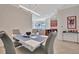 Modern dining area with contemporary gray chairs and a white table at 17108 Vardon Ter # 308, Bradenton, FL 34211