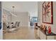 Elegant dining room featuring a modern table and gray chairs at 17108 Vardon Ter # 308, Bradenton, FL 34211