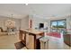 Modern kitchen island with granite countertop and stainless steel appliances at 17108 Vardon Ter # 308, Bradenton, FL 34211