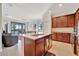 Well-equipped kitchen with granite countertops and wooden cabinets at 17108 Vardon Ter # 308, Bradenton, FL 34211