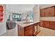 Modern kitchen with island and granite countertops at 17108 Vardon Ter # 308, Bradenton, FL 34211