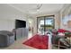 Living room with comfortable seating and balcony access at 17108 Vardon Ter # 308, Bradenton, FL 34211