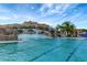 Community pool with a scenic rock waterfall at 17108 Vardon Ter # 308, Bradenton, FL 34211