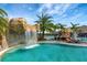 Relaxing pool area with waterfall and lounge chairs at 17108 Vardon Ter # 308, Bradenton, FL 34211