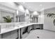 Elegant restroom with multiple sinks and mirrors at 17108 Vardon Ter # 308, Bradenton, FL 34211