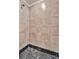 Large walk-in shower with hexagonal tile flooring at 17108 Vardon Ter # 308, Bradenton, FL 34211
