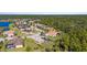 Community overview, showcasing houses with solar panels and a lake at 19718 Cobblestone Cir, Venice, FL 34292