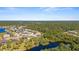 Birds-eye view of community, featuring houses near a lake and conservation area at 19718 Cobblestone Cir, Venice, FL 34292