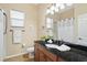 Bathroom with granite countertop, shower, and toilet at 19718 Cobblestone Cir, Venice, FL 34292