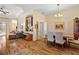 Formal dining room with hardwood floors, chandelier, and seating for six at 19718 Cobblestone Cir, Venice, FL 34292