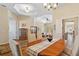 Elegant dining room with hardwood floors, chandelier, and views to kitchen and living room at 19718 Cobblestone Cir, Venice, FL 34292