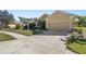 Attractive single-story home with a two-car garage and well-manicured lawn at 19718 Cobblestone Cir, Venice, FL 34292