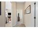 Home hallway with carpet flooring and artwork on the walls at 19718 Cobblestone Cir, Venice, FL 34292