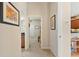 Home hallway with access to bedrooms and kitchen at 19718 Cobblestone Cir, Venice, FL 34292