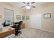 Bright home office features built-in desk, hardwood floors, and ample natural light at 19718 Cobblestone Cir, Venice, FL 34292