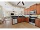 Well-equipped kitchen boasting stainless steel appliances and wood cabinets at 19718 Cobblestone Cir, Venice, FL 34292