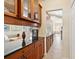 Updated kitchen with granite countertops, wood cabinets, and walk-in pantry at 19718 Cobblestone Cir, Venice, FL 34292