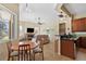 Modern kitchen with stainless steel appliances, breakfast nook, and views to living room at 19718 Cobblestone Cir, Venice, FL 34292