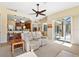 Bright living room with fireplace, comfy seating and view to pool at 19718 Cobblestone Cir, Venice, FL 34292