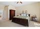 Spacious main bedroom with a large bed, ensuite bathroom, and walk-in closet at 19718 Cobblestone Cir, Venice, FL 34292