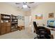 Home office with built-in shelves and comfortable chair at 19718 Cobblestone Cir, Venice, FL 34292