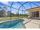 Inviting screened pool area with backyard access at 19718 Cobblestone Cir, Venice, FL 34292