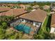 Aerial view of private pool and surrounding landscape at 232 Benedetto Ct, Nokomis, FL 34275