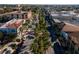 Aerial view of tree-lined street and businesses at 232 Benedetto Ct, Nokomis, FL 34275