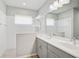 Bathroom with double vanity, walk-in shower, and tile flooring at 232 Benedetto Ct, Nokomis, FL 34275