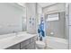 Small bathroom with single vanity, tub, and shower at 232 Benedetto Ct, Nokomis, FL 34275