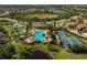 Aerial view of community pool, tennis, and pickleball at 232 Benedetto Ct, Nokomis, FL 34275