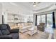Open living space with adjacent kitchen and access to patio at 232 Benedetto Ct, Nokomis, FL 34275