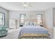 Large bedroom with light-toned furnishings and ceiling fan at 232 Benedetto Ct, Nokomis, FL 34275