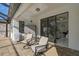 Covered patio with comfortable seating and access to the pool at 232 Benedetto Ct, Nokomis, FL 34275
