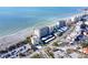 Aerial view of beachfront condo building with parking and pool at 255 The Esplanade N # 603, Venice, FL 34285