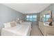 Guest bedroom with two twin beds and dresser, featuring an ocean view at 255 The Esplanade N # 603, Venice, FL 34285