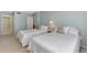 Guest bedroom with two twin beds and access to a bathroom at 255 The Esplanade N # 603, Venice, FL 34285