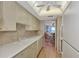 Efficient kitchen with white cabinets and ocean view at 255 The Esplanade N # 603, Venice, FL 34285