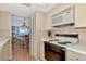 Bright kitchen with white cabinets and updated appliances at 255 The Esplanade N # 603, Venice, FL 34285